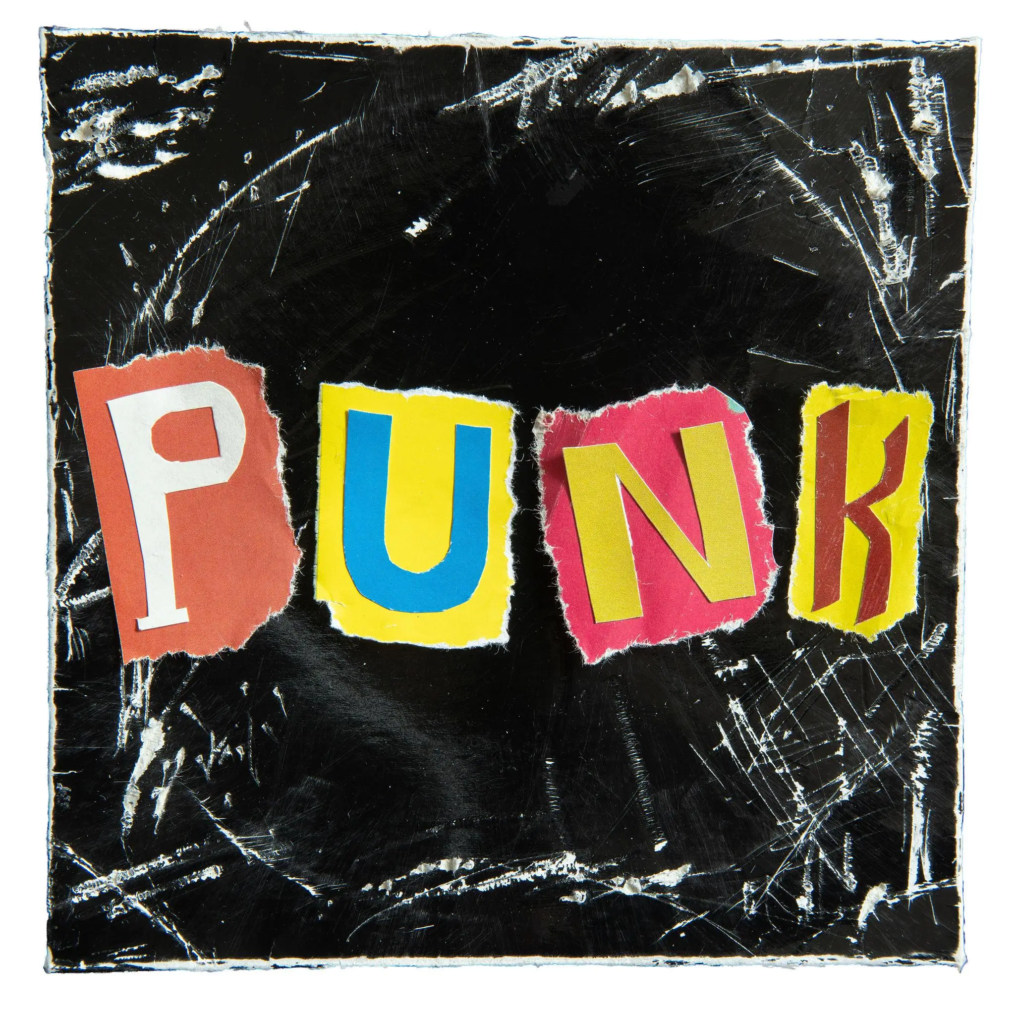 Graphic collage-style image featuring the word “PUNK” spelled out with cut-out, mismatched letters in bold colors—red, yellow, blue, and pink—each on torn paper backgrounds. The letters are arranged across a heavily scratched and distressed black surface, giving a raw, DIY aesthetic reminiscent of zine culture and underground punk graphics. The rough edges, visible wear, and chaotic textures emphasize rebellion, imperfection, and handmade energy