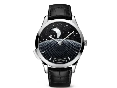 Van Cleef & Arpels Midnight Jour Nuit Phase de Lune watch on a clean white background, featuring a polished white gold case, black alligator strap, and aventurine dial with crescent moon, stars, and textured guilloché horizon