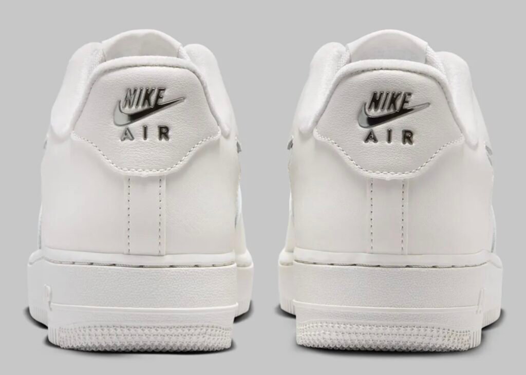 Heel view of Women’s Nike Air Force 1 Low IU7558-030 Phantom white with metallic silver Nike Air branding