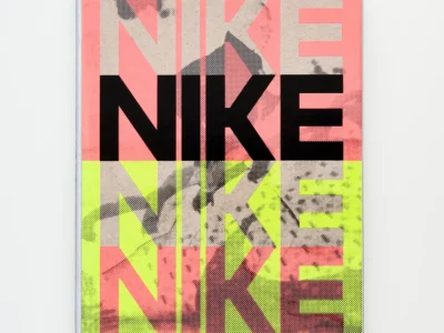 Front cover of Nike: Better Is Temporary by Phaidon featuring bold layered “NIKE” typography over a pink and neon green color-blocked background with textured archival imagery beneath