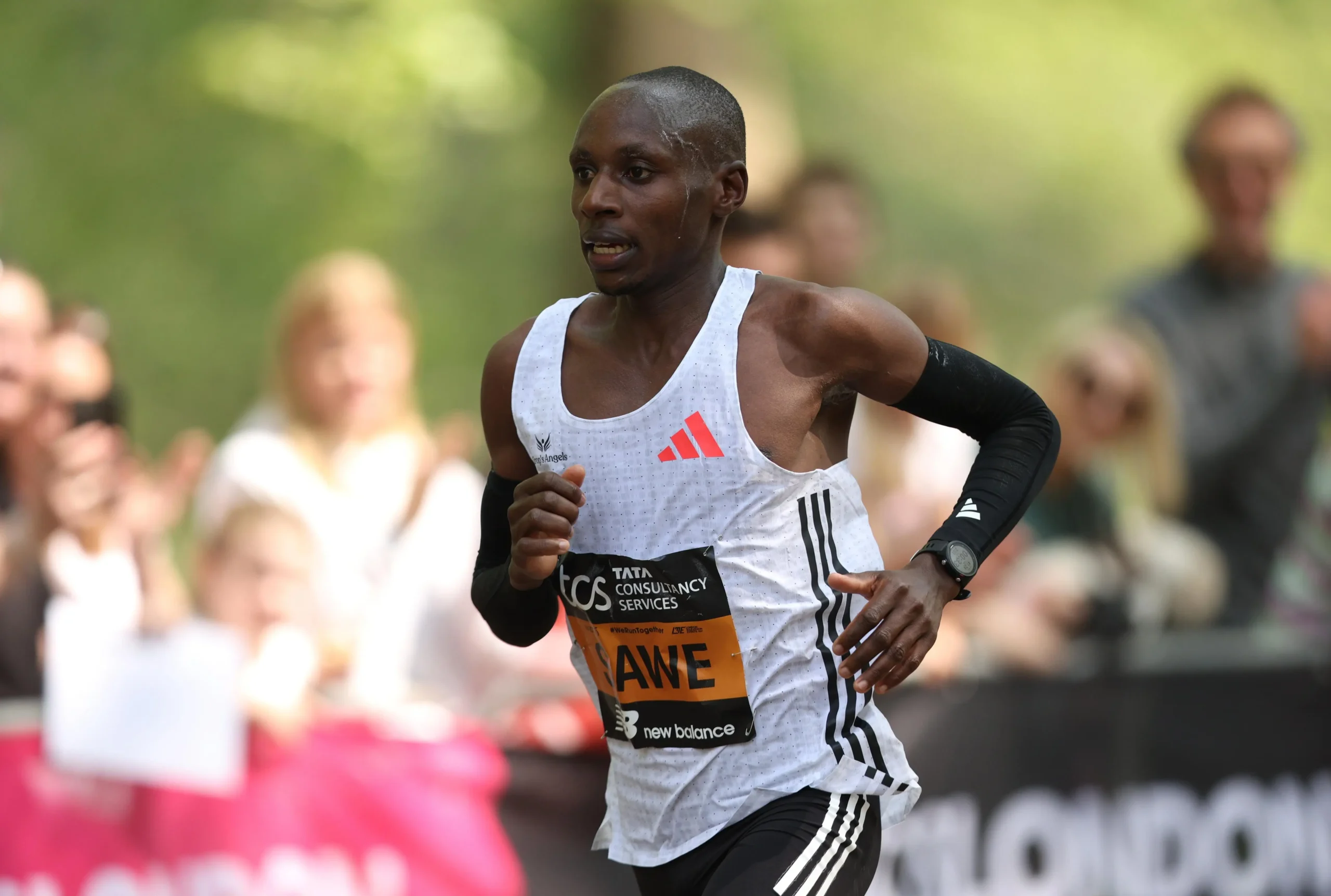Sabastian Sawe running at the 2026 London Marathon in his white Adidas kit