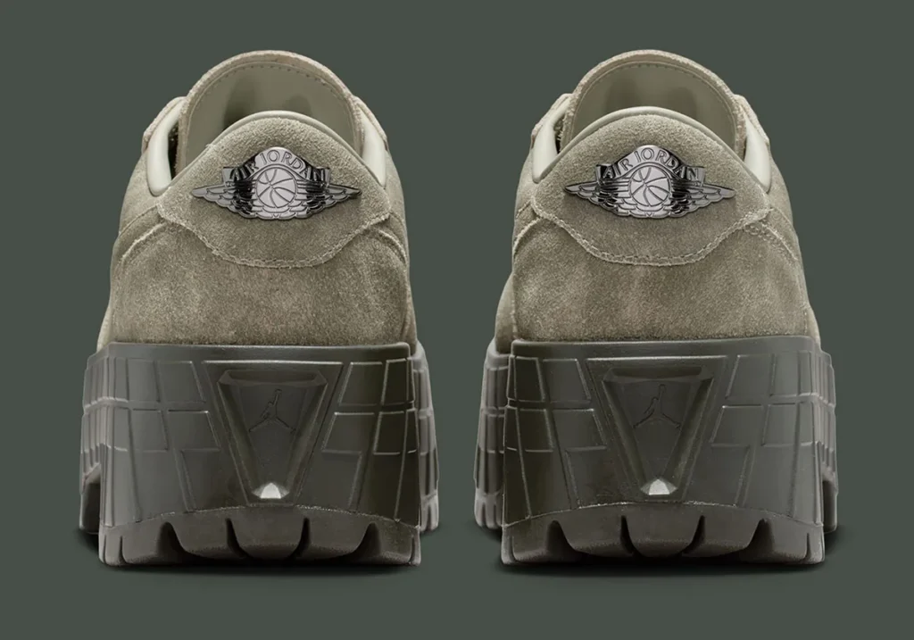 Rear view of the Air Jordan 1 Low Brooklyn “Cargo Khaki” showing dual heels in soft suede with metallic Wings logos, padded collars, and a chunky olive platform sole featuring geometric paneling, embossed Jumpman detail, and deep lug traction at the base