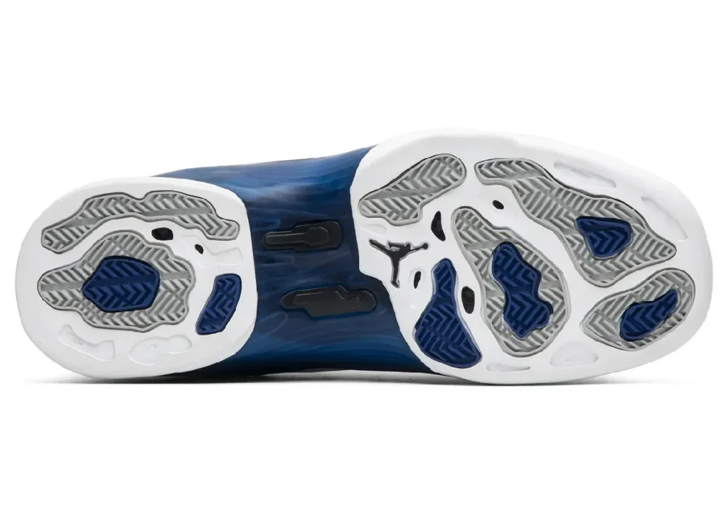 Outsole view of Air Jordan 17 “College Blue” featuring white rubber base with blue and grey traction pods, herringbone patterns, visible midfoot plate, and Jumpman logo at the center