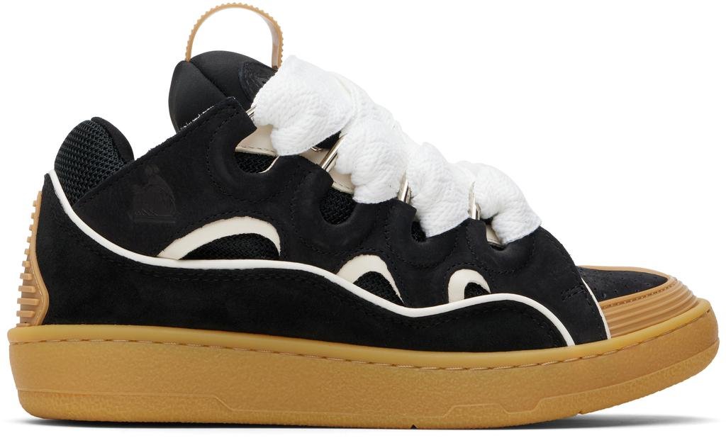 Lanvin Curb shoe in black leather on a white background, featuring oversized silhouette, cutout panels, thick white laces, and a gum rubber sole