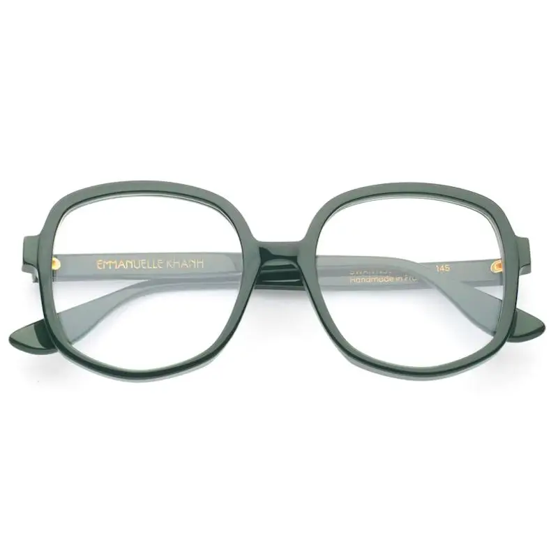 Oversized square eyeglasses in matte forest green acetate with softly rounded edges, featuring a bold, structured frame, wide temples with gold Emmanuelle Khanh branding, and subtle gold hinge accents, displayed on a clean white background