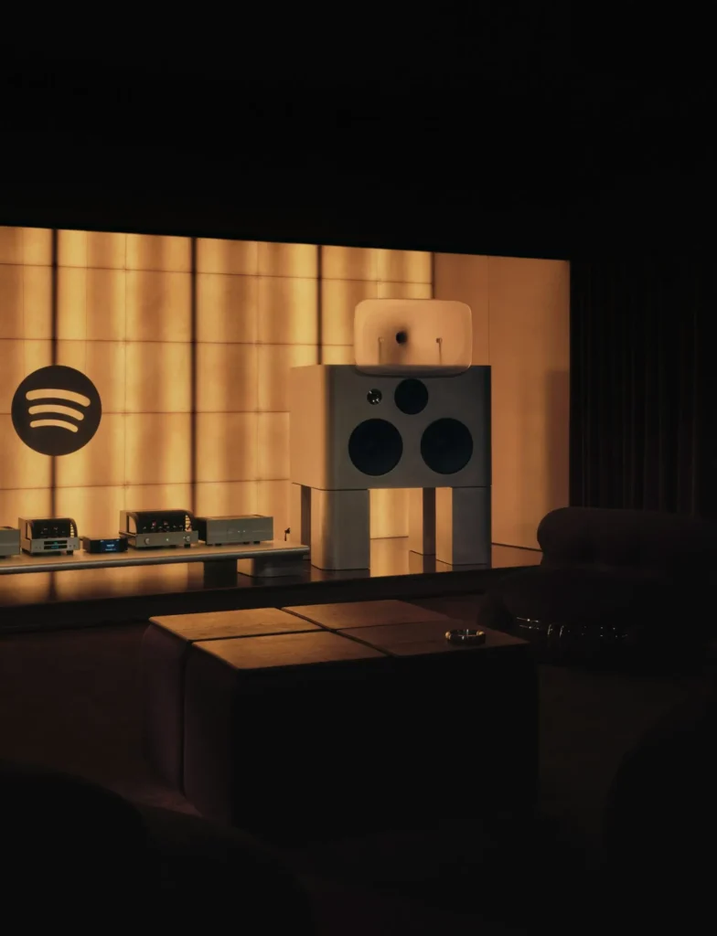 Spotify Listening Lounge London interior with bespoke speaker system, warm acoustic panel lighting, and minimalist high-fidelity audio setup
