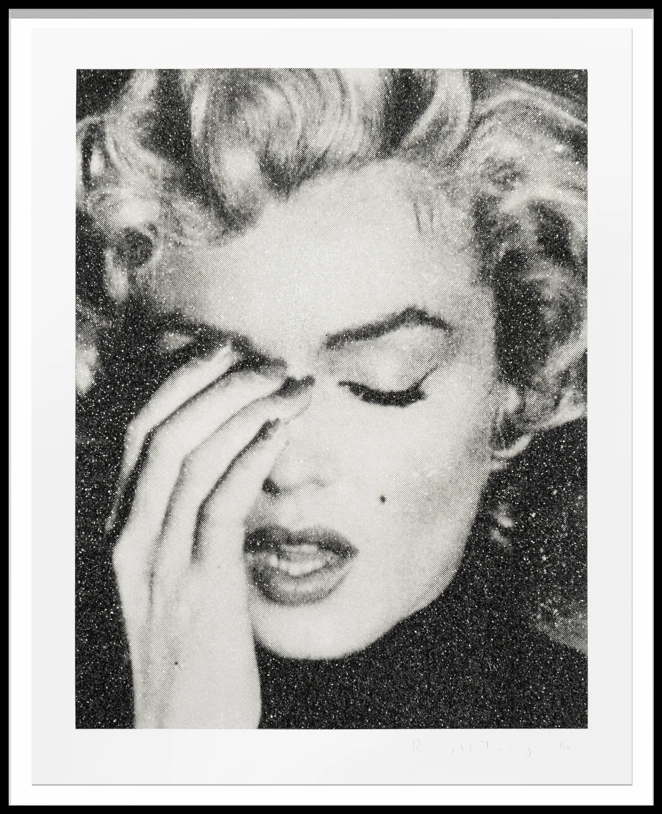Diamond dust silkscreen portrait of Marilyn Monroe by Russell Young, showing her with eyes closed and hand touching her face, rendered in high-contrast black and white with a shimmering, textured surface