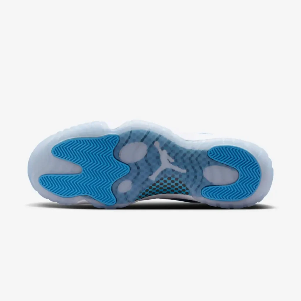 Air Jordan 11 Low UNC outsole in icy translucent rubber with Carolina blue herringbone traction pods and visible Jumpman logo