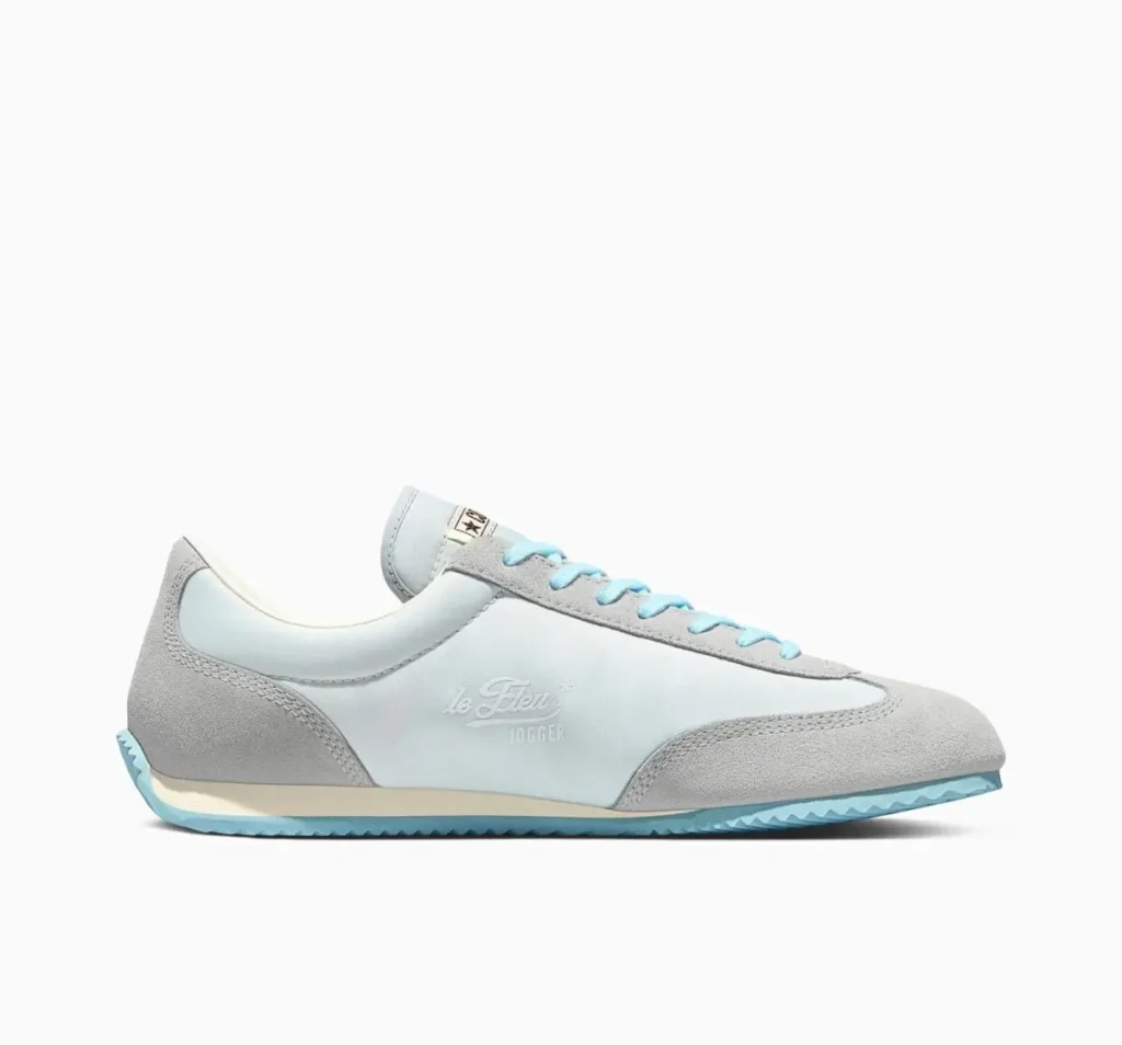 Side profile of the GOLF le FLEUR* Converse 1908 Jogger “Foggy Dew” in soft blue nylon with grey suede paneling