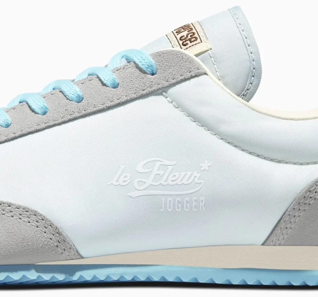 Close-up of GOLF le FLEUR* x Converse 1908 Jogger “Foggy Dew” showing pale blue upper, grey suede overlays, tonal logo embossing, and pastel lace detailing