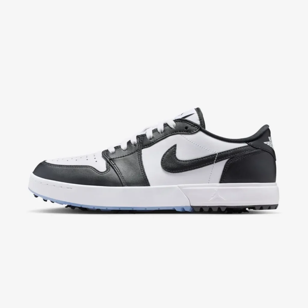 Air Jordan 1 Low Golf Spiked Concord in side profile featuring white leather base, black overlays and Swoosh, low-cut silhouette, and spiked outsole for traction on the course