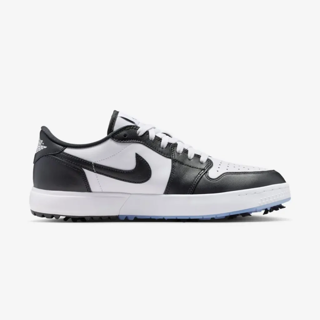 Air Jordan 1 Low Golf Spiked Concord lateral view featuring white leather base, black overlays and Swoosh, low-cut profile, and spiked outsole for on-course traction
