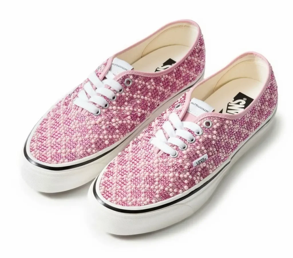 featuring white laces, silver eyelets, and an off-white sole against a clean studio background
