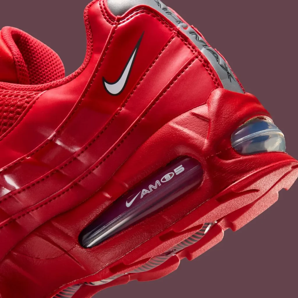 Close-up heel detail of Nike Air Max 95 Total 90 “University Red” showing red layered upper, mini Swoosh branding, and visible Air Max cushioning unit within sculpted midsole