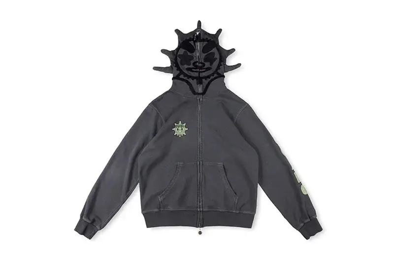 Grey Glo Gang Glo Man full zip hoodie featuring a sculpted black character hood with spiked detailing, tonal face design, front zipper closure, kangaroo pockets, and subtle chest and sleeve graphics on a neutral background