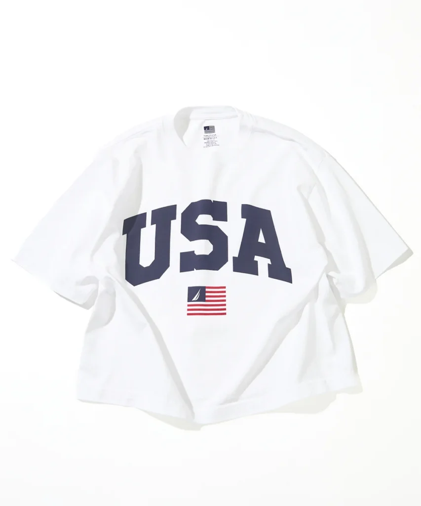 White Nautica Made in USA oversized T-shirt showcasing large USA varsity lettering and classic Nautica flag emblem