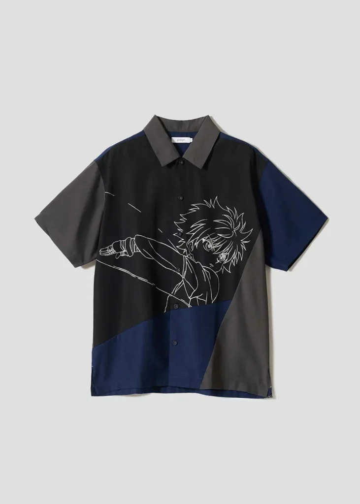 Color-block short-sleeve shirt in black, grey, and navy featuring oversized line-art anime character illustration across the front