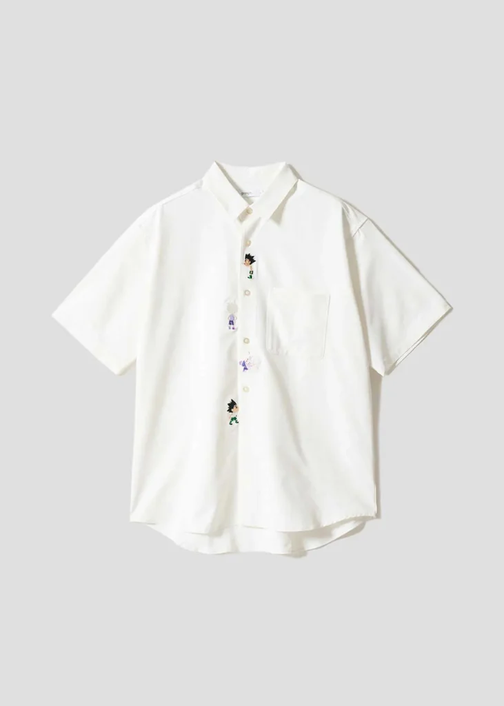 White short-sleeve button-up shirt detailed with embroidered character icons running vertically alongside the placket and a clean minimalist finish
