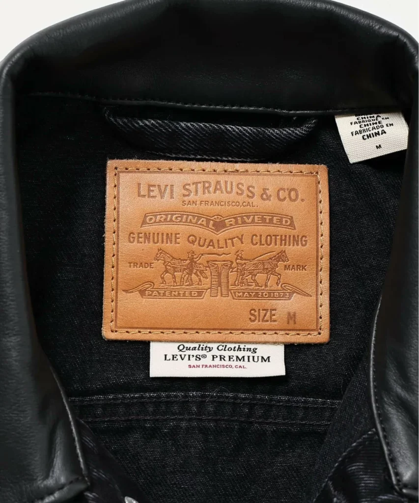Interior neck label detail featuring the iconic Levi Strauss & Co. leather patch and premium collision brand