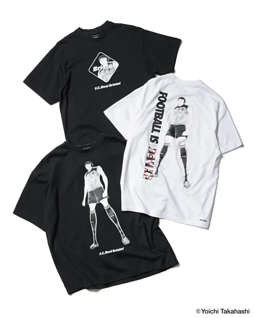 Black and white F.C. Real Bristol graphic T-shirts featuring manga-style football illustrations displayed flat against a neutral backdrop. The collection includes monochrome tees printed with an illustrated football player figure and layered “FOOTBALL IS NEVER” typography, alongside the Bristol diamond logo rendered with anime-inspired artwork. The designs blend Japanese manga aesthetics, football culture, and contemporary streetwear graphics through minimalist black-and-white styling and oversized athletic silhouettes