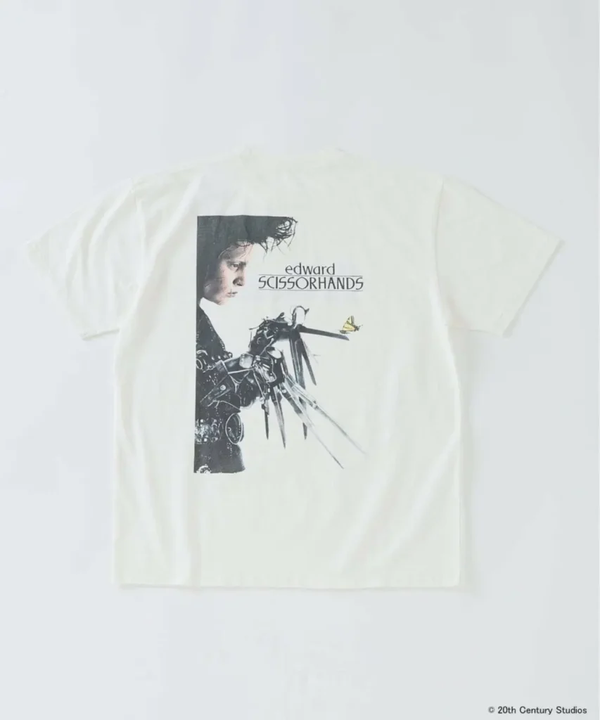 Back view of off-white Edward Scissorhands T-shirt featuring a portrait graphic of Edward with scissor blades and butterfly detail