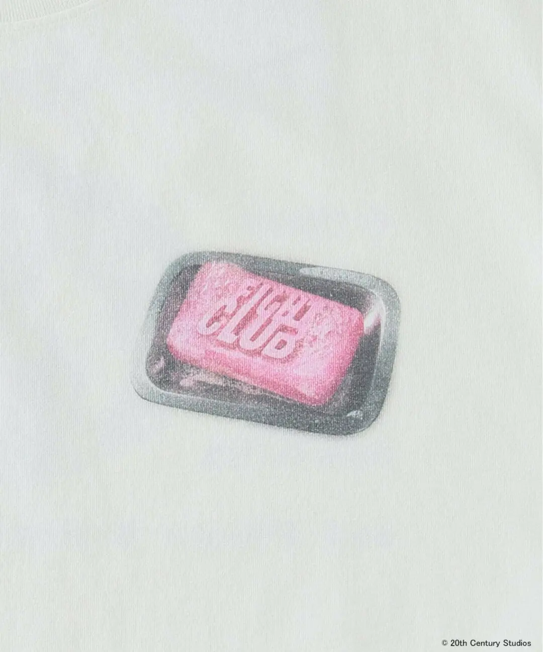 Minimal chest graphic detail on off-white Fight Club T-shirt featuring the film’s iconic pink soap bar motif resting in a glossy black tray