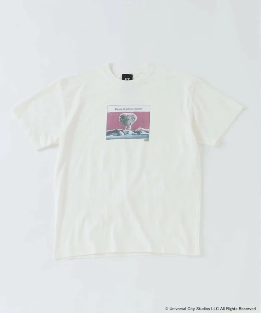Front view of off-white E.T. graphic T-shirt featuring retro illustration of E.T. with text reading Trying to phone home?