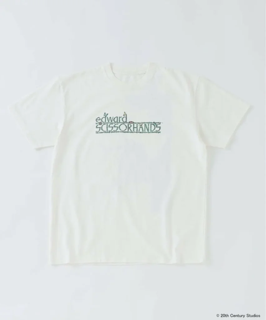 Front view of off-white Edward Scissorhands T-shirt featuring distressed logo typography across the chest inspired by the film’s gothic fantasy identity