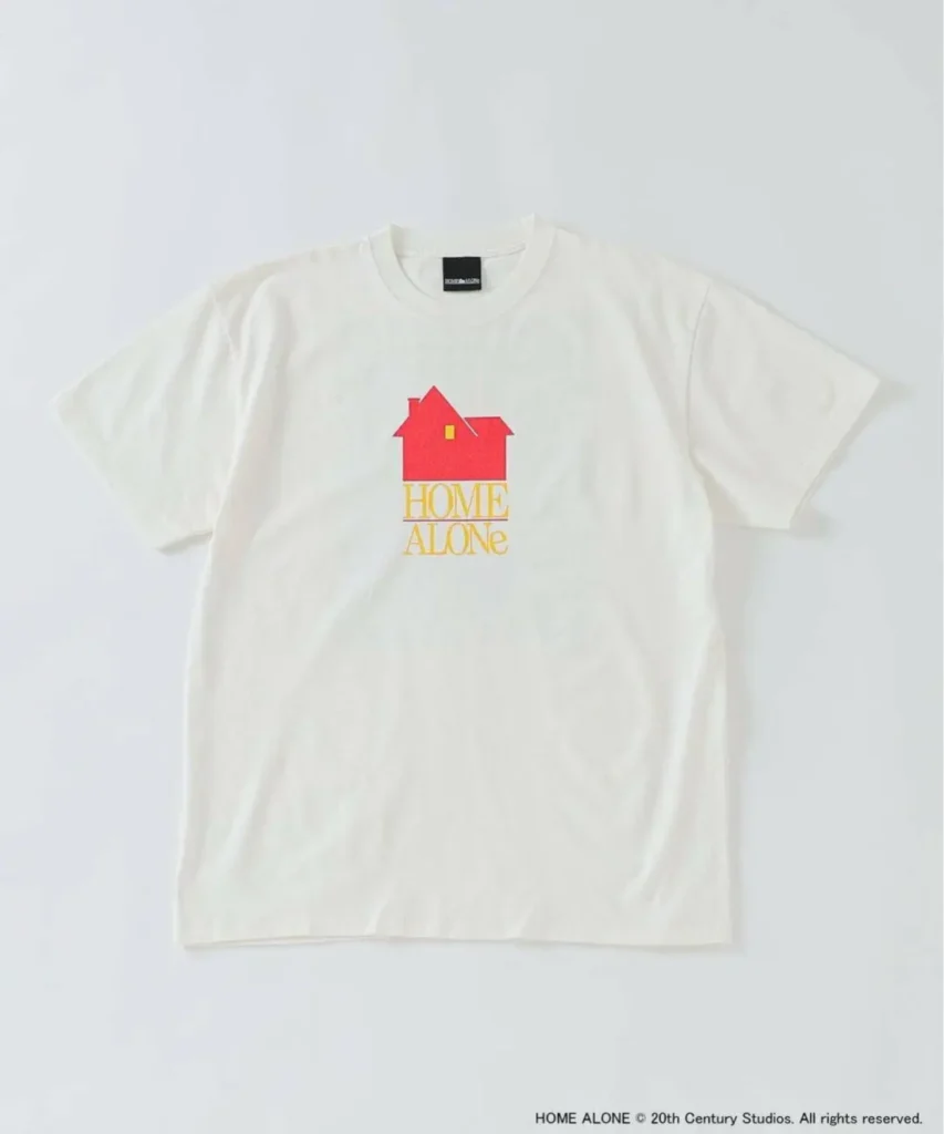 Front view of off-white Home Alone graphic T-shirt featuring a minimalist red house icon above stacked yellow Home Alone lettering