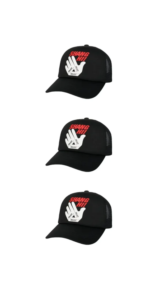 Multiple angled views of a black Palace trucker cap featuring bold red “SHANG HI!” lettering above a white hand graphic forming the iconic Palace Tri-Ferg logo. The cap combines a curved brim, mesh side panels, and the playful city-exclusive branding created for the Palace Shanghai flagship collection