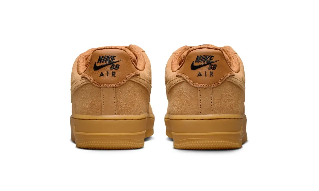 Rear heel view of the Nike SB Air Force 1 Low “Wheat” featuring black Nike SB Air embroidery against the golden Flax suede and gum outsole