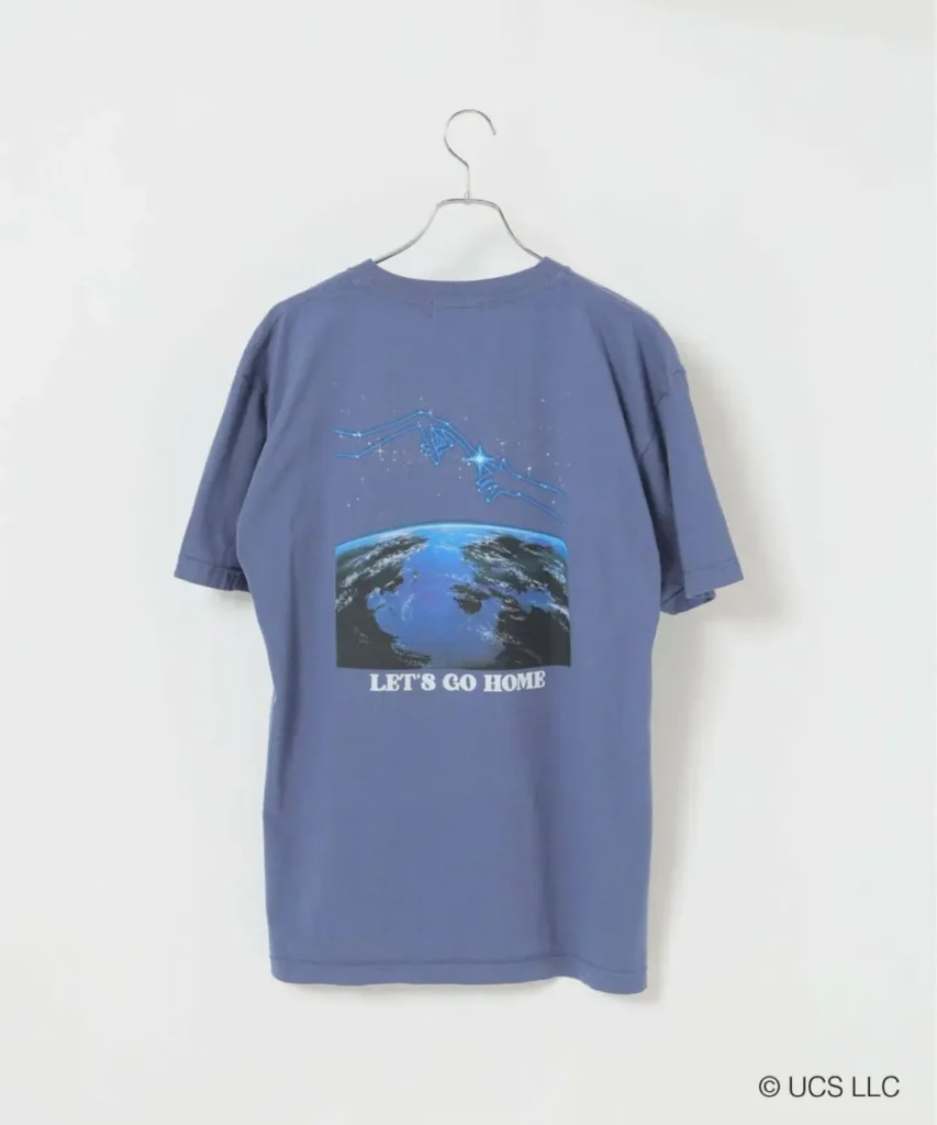 Rear view of the blue E.T. graphic T-shirt featuring illustrated glowing fingertips above Earth with “LET’S GO HOME” text and vintage sci-fi poster show
