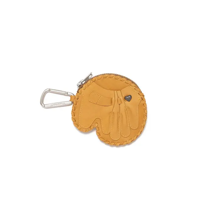 A minimalist product image showcasing a Human Made baseball glove-inspired leather accessory against a clean neutral backdrop. Designed in the shape of a vintage catcher’s mitt, the compact piece features detailed stitching, embossed panel construction, a small heart-shaped metal accent, and a silver carabiner attachment for functional everyday use. Blending nostalgic American sports references with playful luxury streetwear detailing, the accessory reflects Human Made’s signature fascination with retro craftsmanship and collectible-inspired design objects