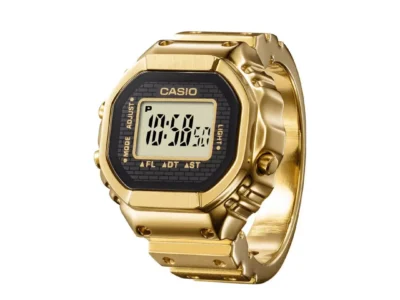 Front-facing studio image of the gold Casio Ring Watch featuring the tiny digital LCD screen, retro Casio styling, and polished gold-tone stainless steel finish