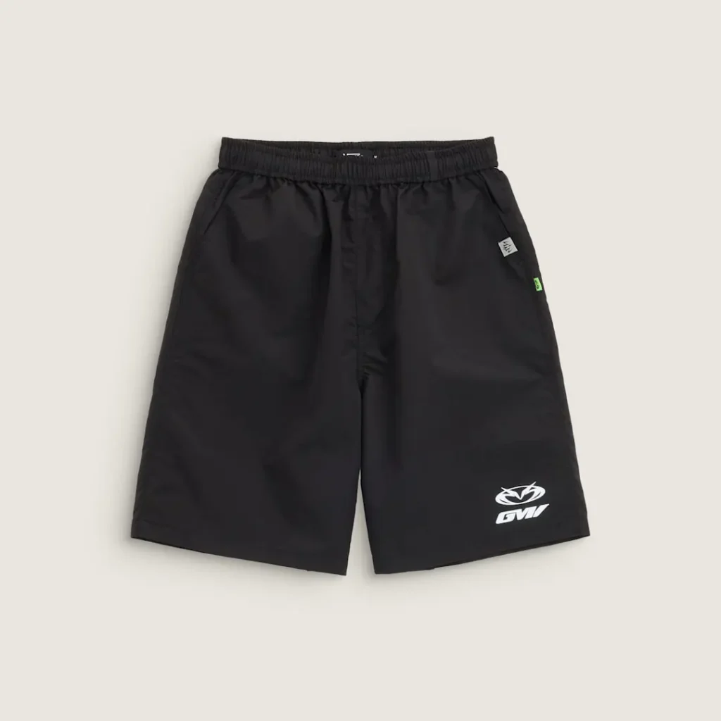 Black Vans x GUCCIMAZE shorts featuring a relaxed fit, lightweight construction, and collaborative logo branding positioned on the lower leg