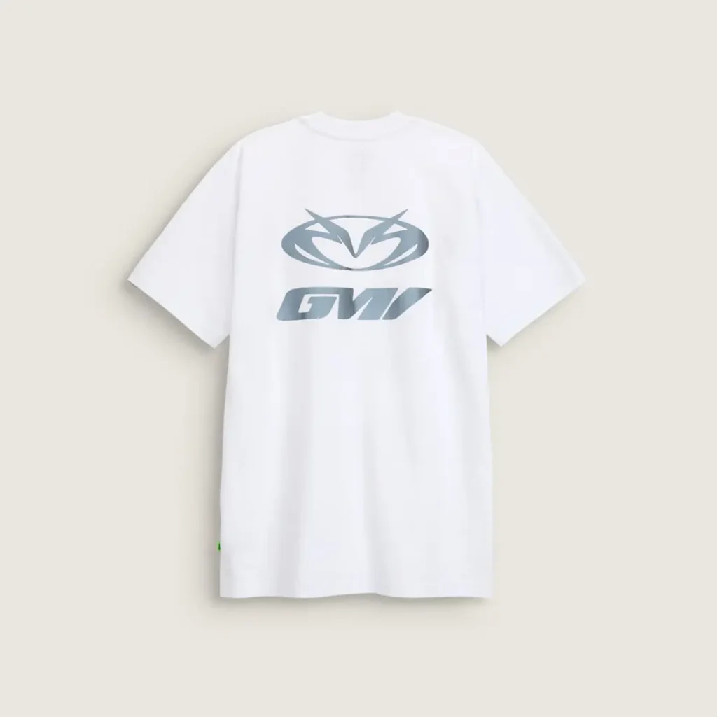 Back view of the white Vans x GUCCIMAZE T-shirt showcasing a large reflective logo graphic inspired by the artist’s signature view id