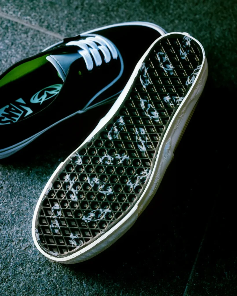 Detailed look at the Vans x GUCCIMAZE waffle outsole featuring custom graphic branding integrated into the classic traction pattern of the Authentic silhouette