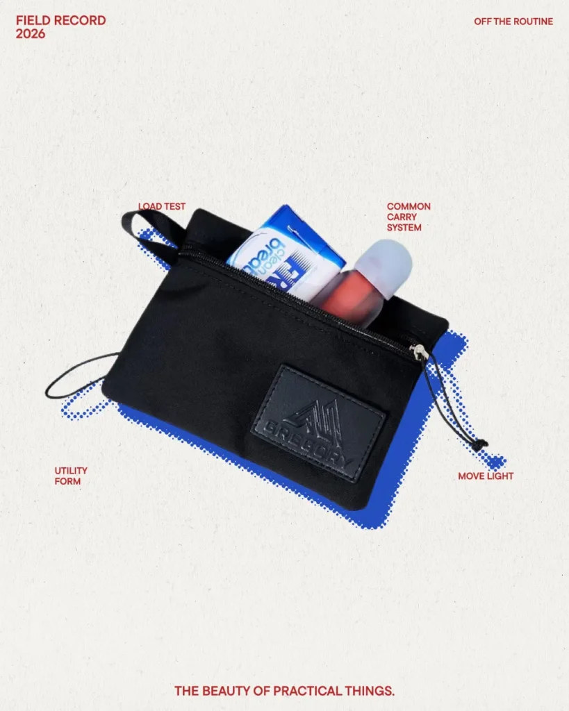 Compact black GREGORY zip pouch with utility loop and everyday essentials styled in lightweight carry campaign imagery