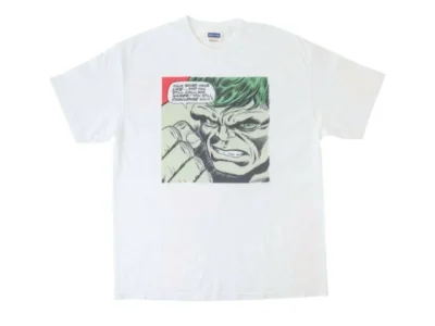 White VARIEGATOR short-sleeve graphic T-shirt featuring a vintage comic-panel illustration of Hulk in close-up with distressed print detailing and retro comic text elements