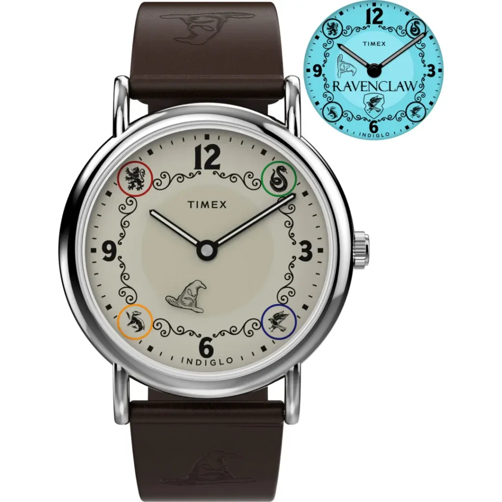 Studio product image of the Timex x Harry Potter and the Philosopher's Stone Ravenclaw Weekender watch featuring a cream dial with Hogwarts house emblems, Sorting Hat illustration at 6 o’clock, polished silver-tone case, brown leather strap embossed with Sorting Hat graphics, and a blue INDIGLO® backlight preview displaying Ravenclaw branding