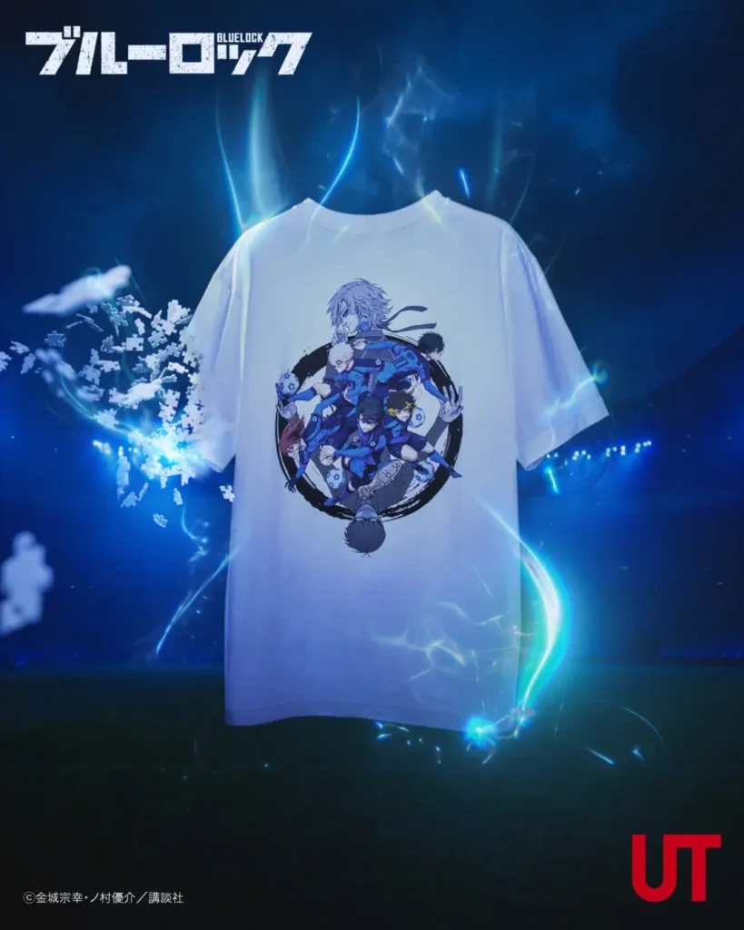 Promotional image for a Blue Lock × UT graphic T-shirt featuring a white short-sleeve tee printed with an ensemble anime soccer illustration in blue and black tones, suspended against a dramatic electric-blue background with glowing energy effects and floating particle elements, with collaboration branding in opposite corners