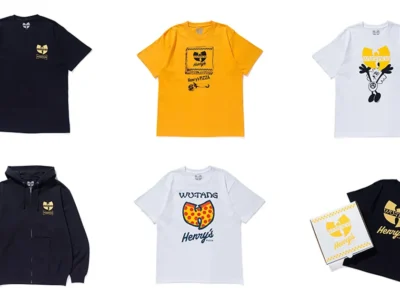 Flat lay of the VERDY x Wu-Tang Clan x Henry’s Pizza collection displayed against a light gray background, featuring six pieces arranged in a grid. The assortment includes black, yellow, and white graphic T-shirts plus a black zip-up hoodie. Designs reinterpret Wu-Tang Clan’s iconic “W” logo through VERDY’s playful streetwear language, incorporating pizza-inspired graphics, Henry’s Pizza branding, hand-drawn typography, and character illustrations. One black tee is shown packaged inside a custom pizza-style box, emphasizing the collection’s crossover between hip-hop, food culture, and Japanese streetwear aesthetics