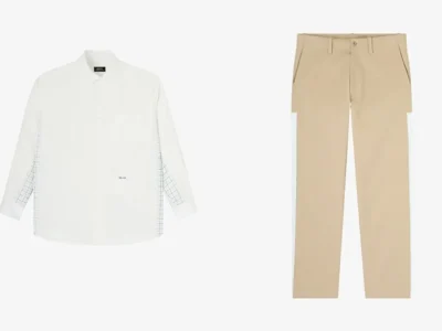 A minimalist navy short-sleeve T-shirt featuring subtle co-branded “A.P.C. / HFMT” chest embroidery in white, presented against a clean light gray background