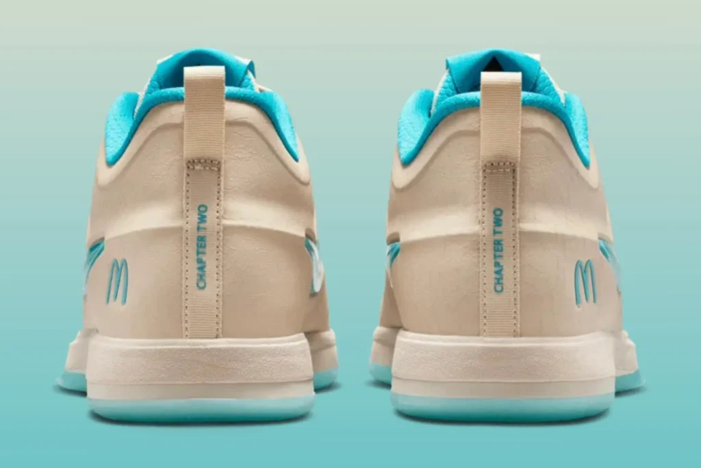 Rear view of the McDonald’s x Nike Book 2 “Sedona” highlighting turquoise interior lining, heel pull tabs, minimalist McDonald’s logo details, and custom Chapter Two branding
