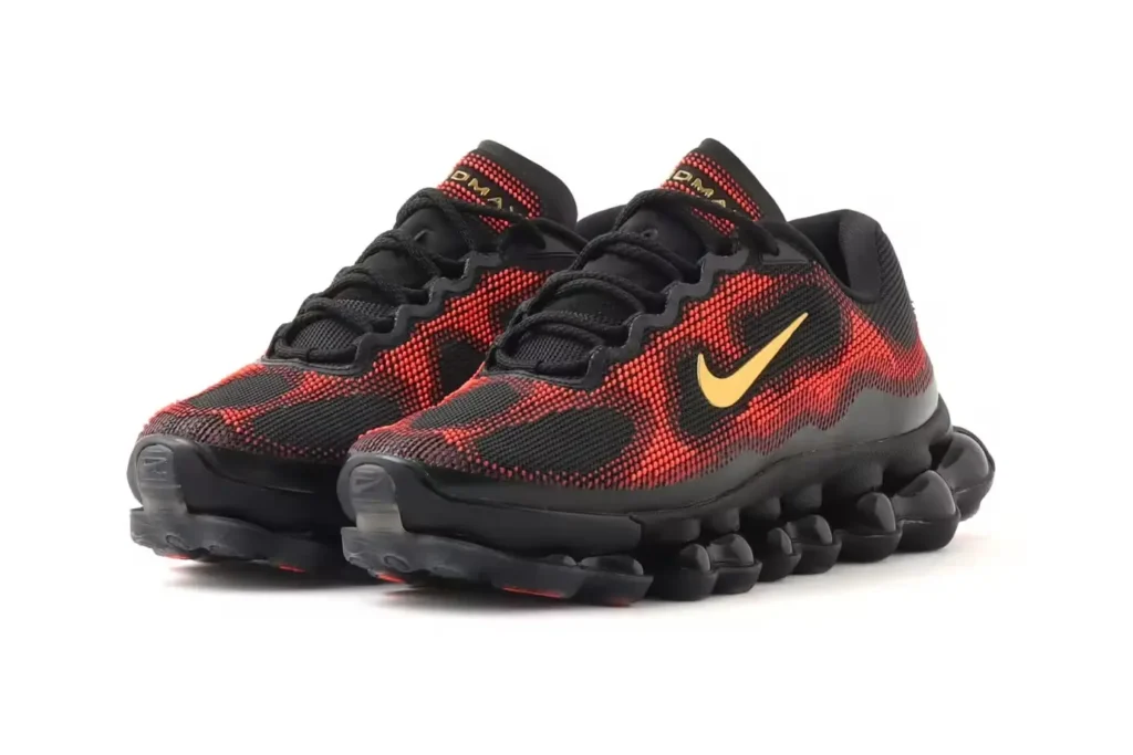 Three-quarter view of the Nike Air Liquid Max “Black/Team Red” pair highlighting the flowing red-to-black upper pattern, low-profile construction, and sculptural full-length Air system