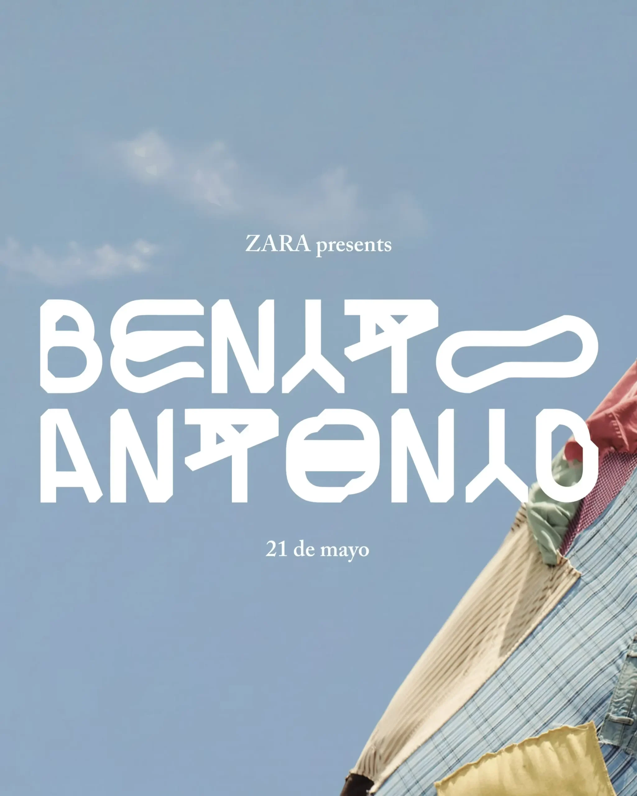 Promotional campaign image for the Zara x Benito Antonio capsule collection featuring bold white futuristic typography against a soft blue sky backdrop, announcing the May 21 launch while showcasing a partial pastel-toned garment composition inspired by Bad Bunny’s Caribbean-influenced aesthetic