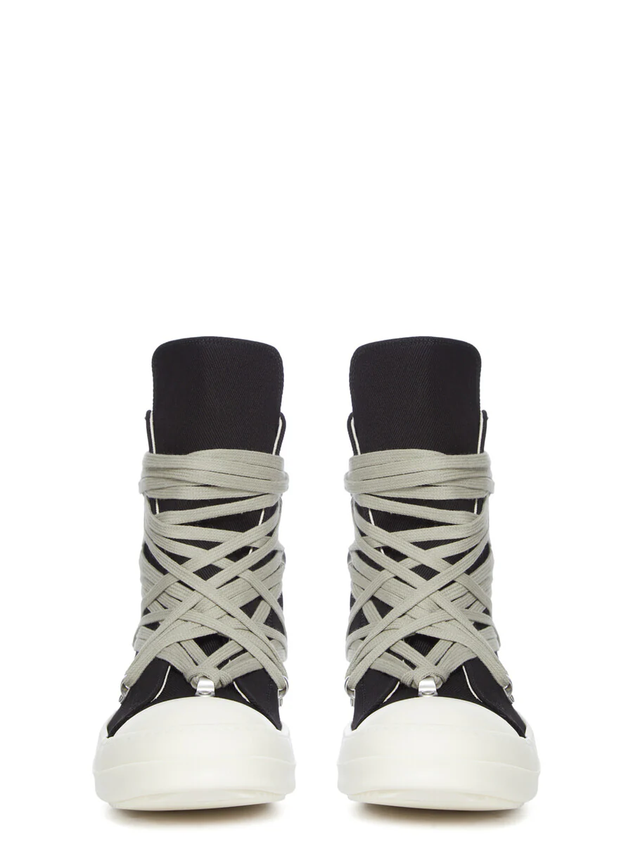 Rick Owens DRKSHDW Temple Megalace® high-top shoe in Black/Milk shown in Front profile, featuring overdyed black denim, oversized wraparound pale laces, sculptural proportions, and an off-white rubber sole