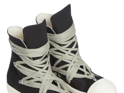 Angled product shot of the Rick Owens DRKSHDW Temple Megalace® shoe pair in Black/Milk showcasing the exaggerated lace wrap, overdyed denim texture, and signature sculptural proportions