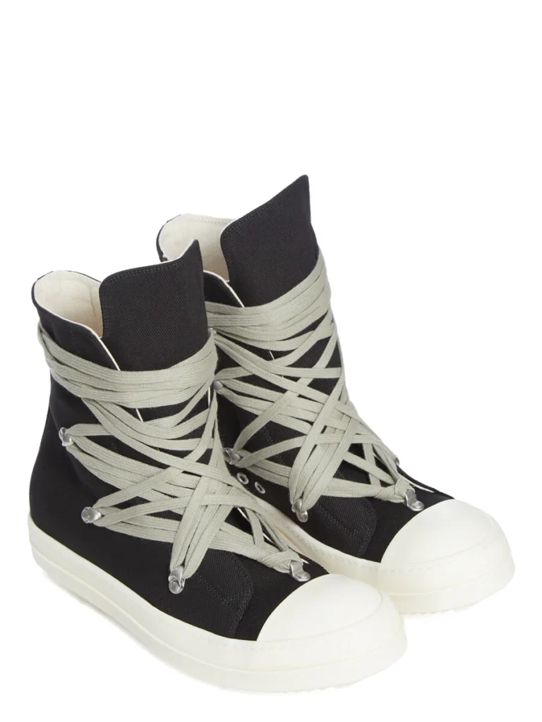 Angled product shot of the Rick Owens DRKSHDW Temple Megalace® shoe pair in Black/Milk showcasing the exaggerated lace wrap, overdyed denim texture, and signature sculptural proportions
