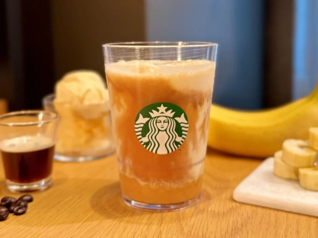 Close-up of Starbucks Japan’s Banana Affogato Frappuccino showing blended banana and espresso naturally marbling together into a smooth dessert-inspired drink